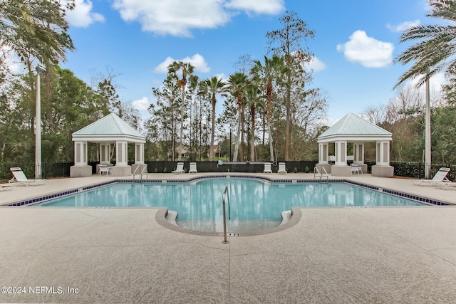 view of pool featuring a patio and a gazebo