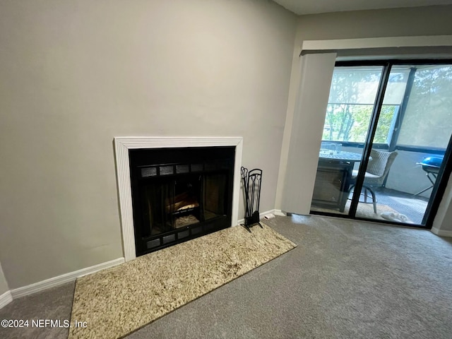 unfurnished living room featuring carpet