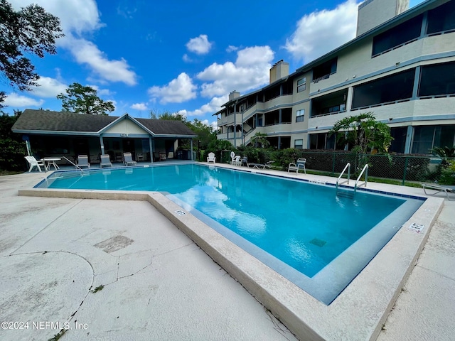 view of pool featuring a patio