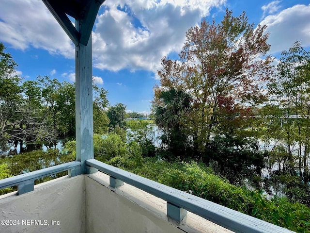 balcony featuring a water view