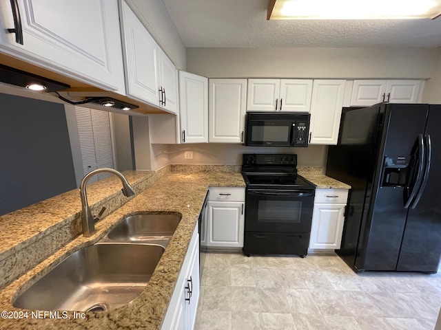 kitchen with white cabinets, a textured ceiling, sink, and black appliances