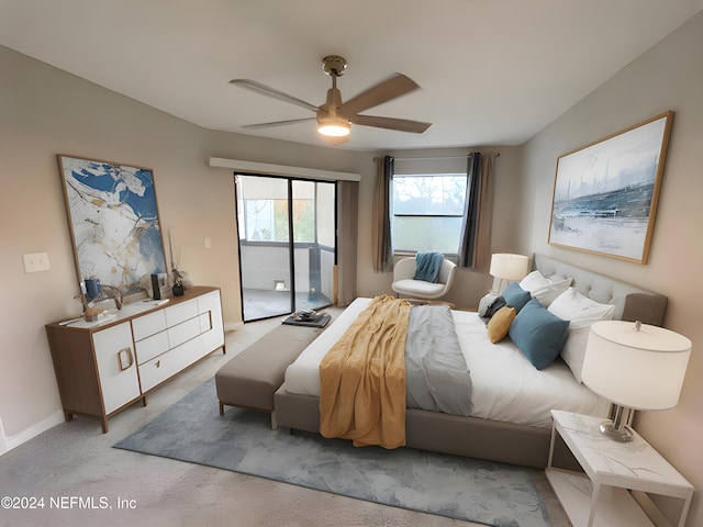 carpeted bedroom featuring ceiling fan and access to exterior