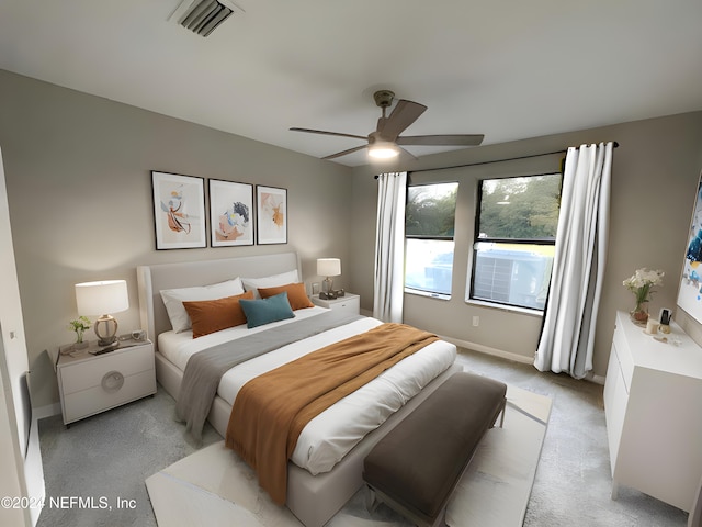 bedroom featuring light colored carpet and ceiling fan