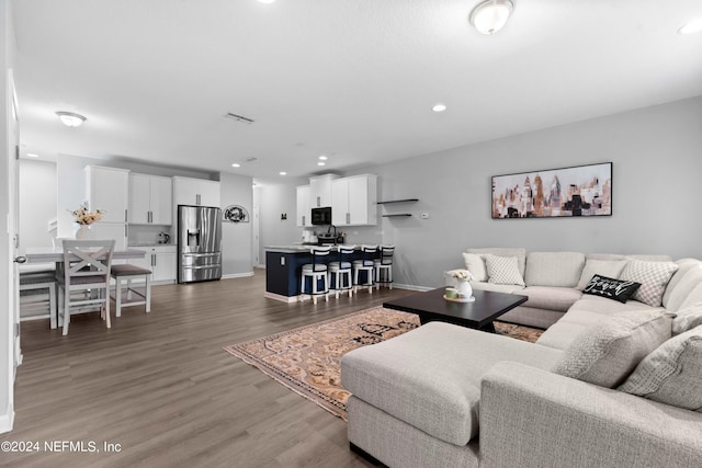 living room featuring dark hardwood / wood-style flooring