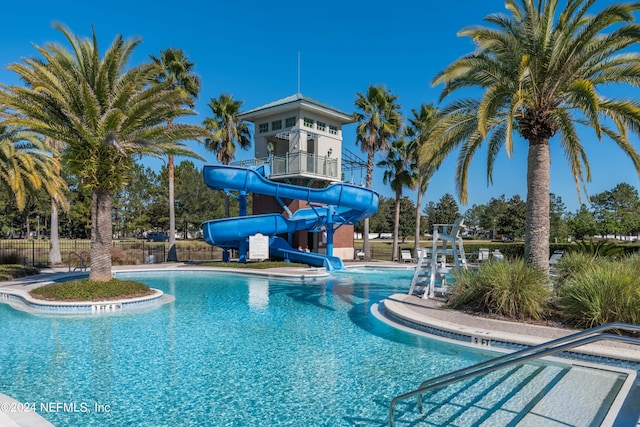 view of pool with a water slide