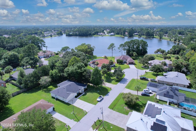 bird's eye view featuring a water view and a residential view