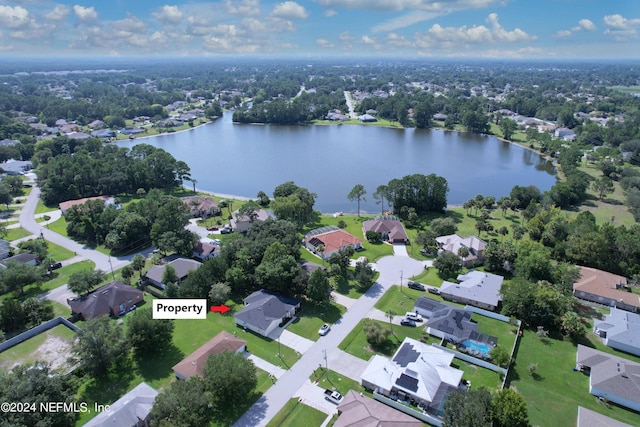aerial view with a residential view and a water view