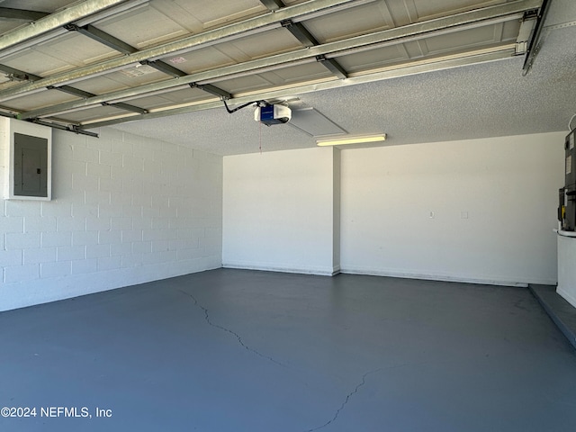 garage featuring a garage door opener and electric panel