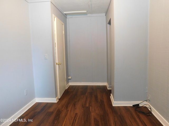 hallway featuring dark hardwood / wood-style flooring