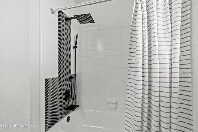 bathroom featuring shower / bathtub combination with curtain