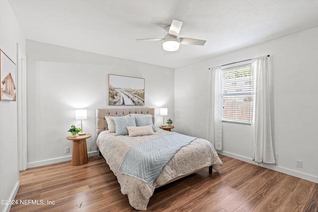 bedroom featuring ceiling fan and hardwood / wood-style floors