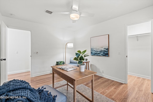 office featuring light wood-type flooring and ceiling fan