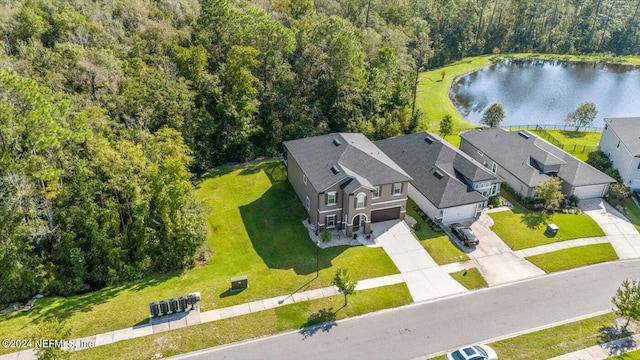 birds eye view of property featuring a water view