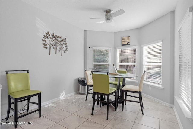 dining room with ceiling fan and light tile patterned floors