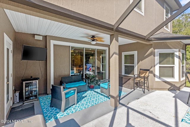 view of patio featuring an outdoor living space and ceiling fan