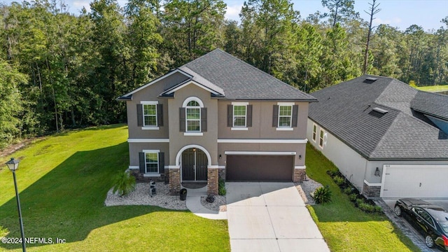 view of front facade featuring a front lawn, central AC unit, and a garage