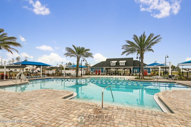 view of swimming pool featuring a patio