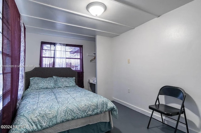 bedroom featuring concrete floors