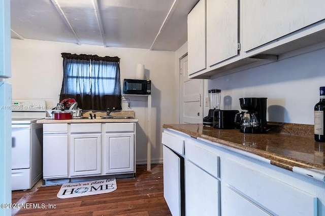 kitchen with white cabinetry, dark hardwood / wood-style floors, and white electric stove