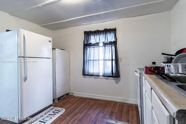 kitchen featuring white cabinets, white appliances, and dark hardwood / wood-style flooring