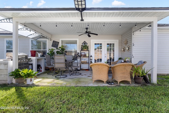 view of patio / terrace with area for grilling, ceiling fan, and french doors