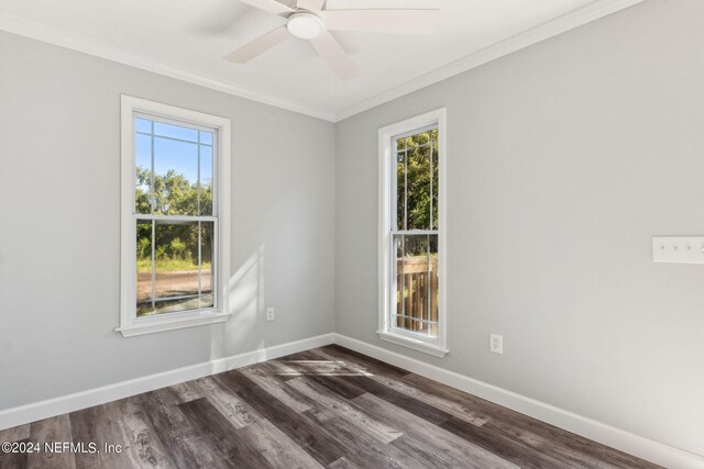 empty room with ceiling fan, dark hardwood / wood-style floors, and crown molding