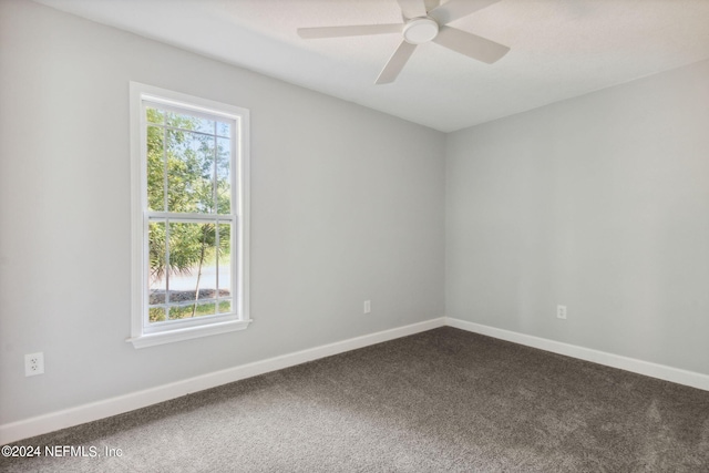 carpeted empty room with ceiling fan