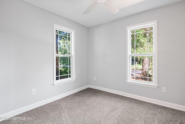 unfurnished room with ceiling fan and carpet floors