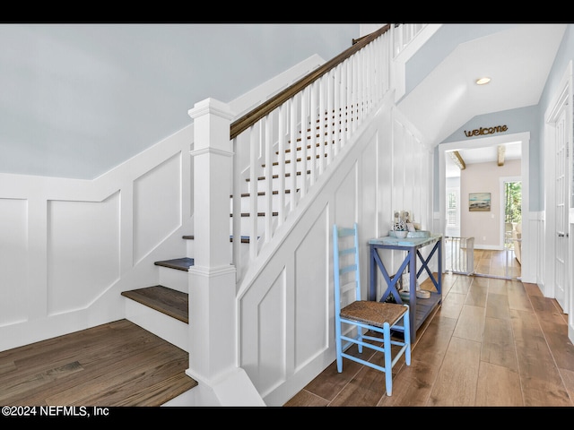 stairway featuring wood-type flooring