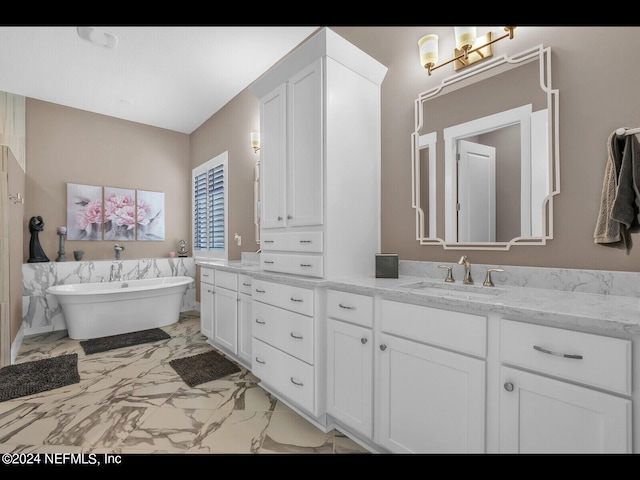 bathroom featuring a tub to relax in and vanity