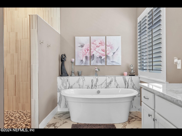 bathroom featuring independent shower and bath and vanity