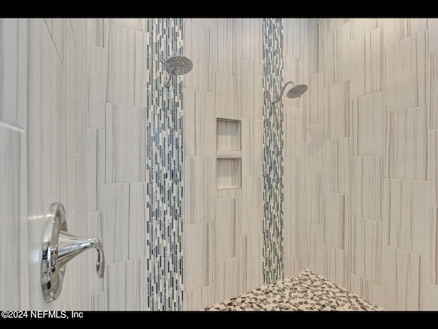 bathroom with tiled shower