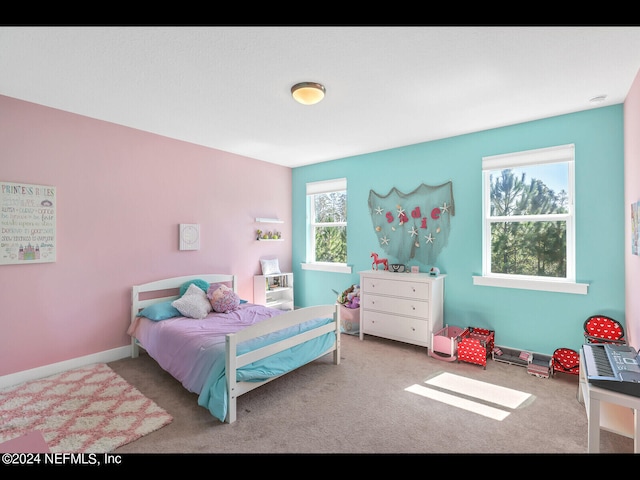 bedroom featuring light carpet