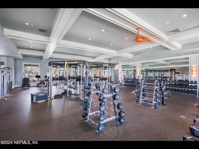 gym featuring coffered ceiling