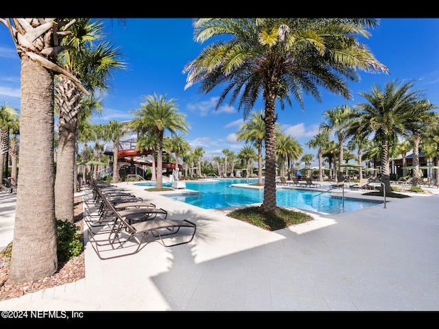 view of swimming pool featuring a patio area