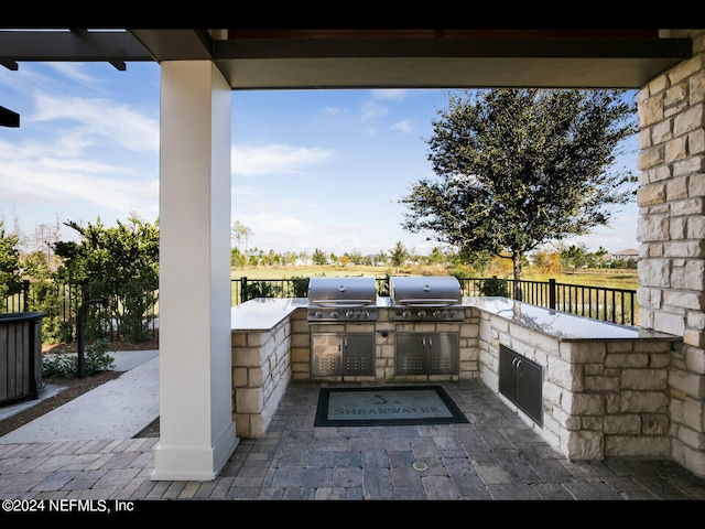 view of patio with area for grilling and grilling area