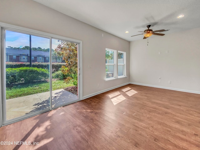 unfurnished room featuring ceiling fan and hardwood / wood-style floors