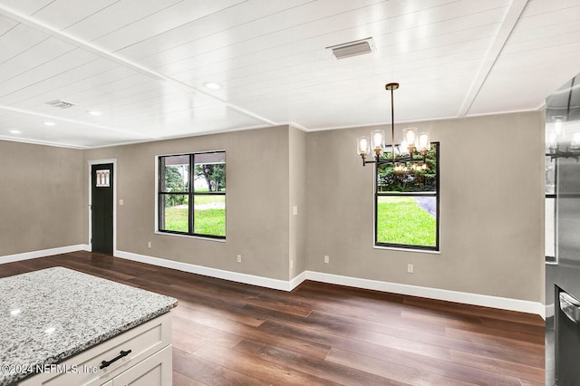 unfurnished room with wood ceiling, an inviting chandelier, and dark wood-type flooring