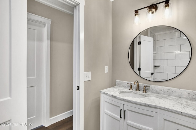 bathroom featuring wood-type flooring and vanity