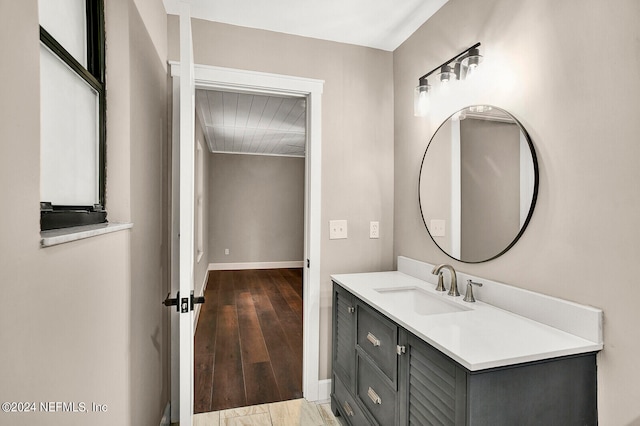 bathroom featuring wood-type flooring and vanity