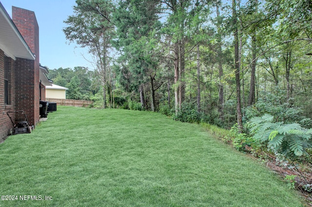 view of yard featuring central air condition unit