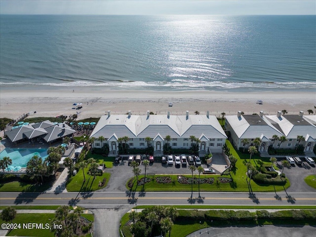 aerial view featuring a water view and a beach view