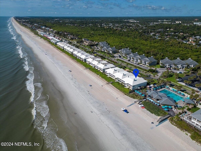 aerial view featuring a water view and a beach view