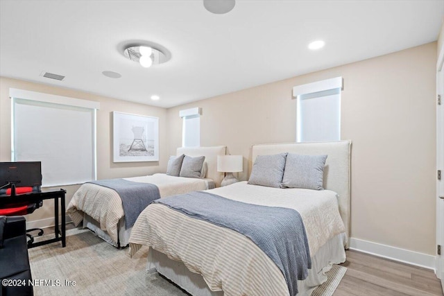 bedroom with light hardwood / wood-style flooring