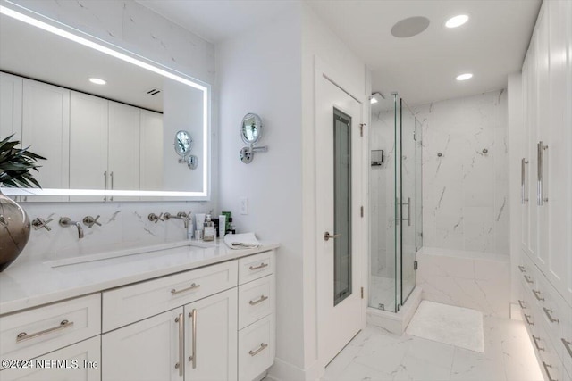 bathroom with vanity and an enclosed shower