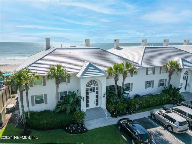 view of front of house with a water view