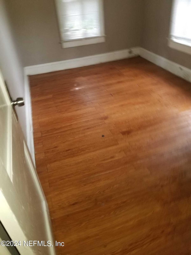 spare room featuring hardwood / wood-style flooring