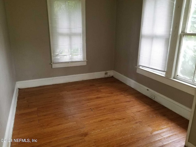 empty room with light hardwood / wood-style floors