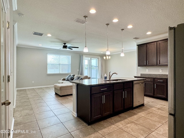 kitchen with sink, appliances with stainless steel finishes, dark brown cabinetry, and an island with sink