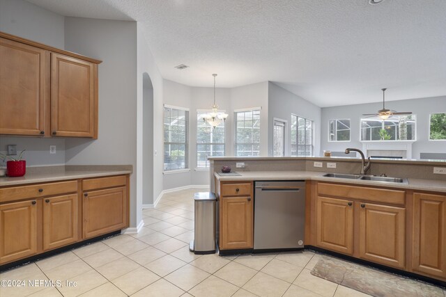 kitchen featuring hanging light fixtures, sink, a textured ceiling, dishwasher, and ceiling fan with notable chandelier